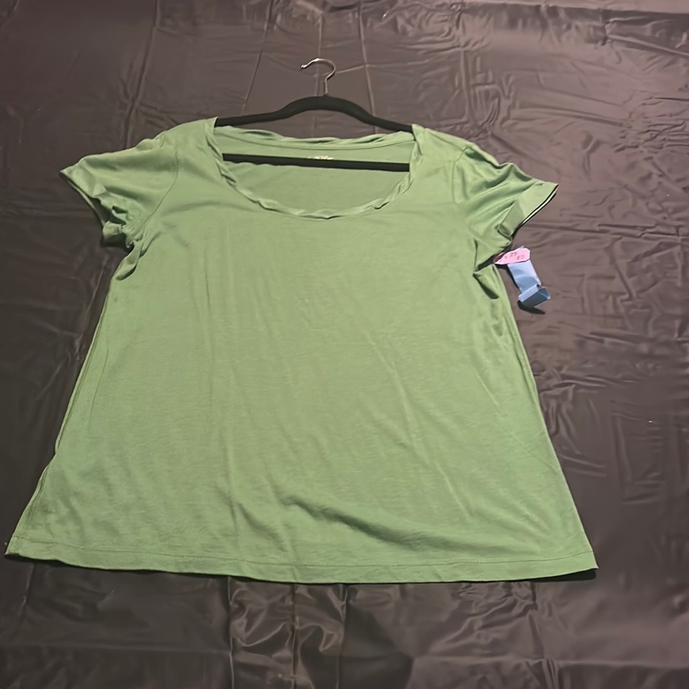 This is a dressy Kelly green T-shirt with silk rolled up sleeves